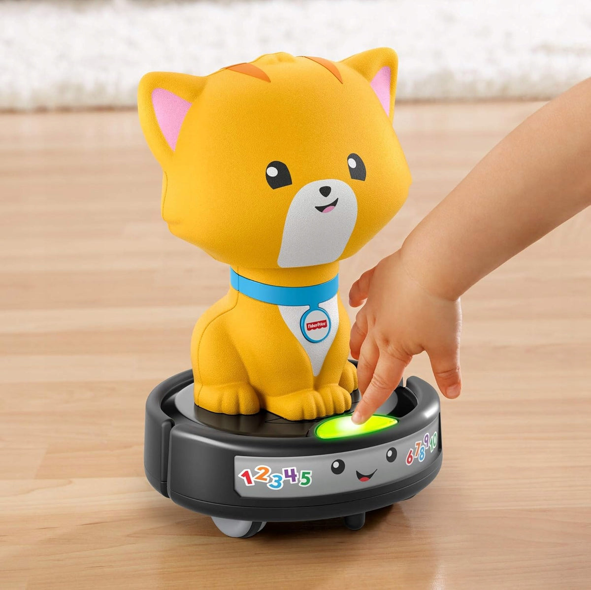 FISHER-PRICE GMX70 cat on a self-propelled vacuum cleaner
