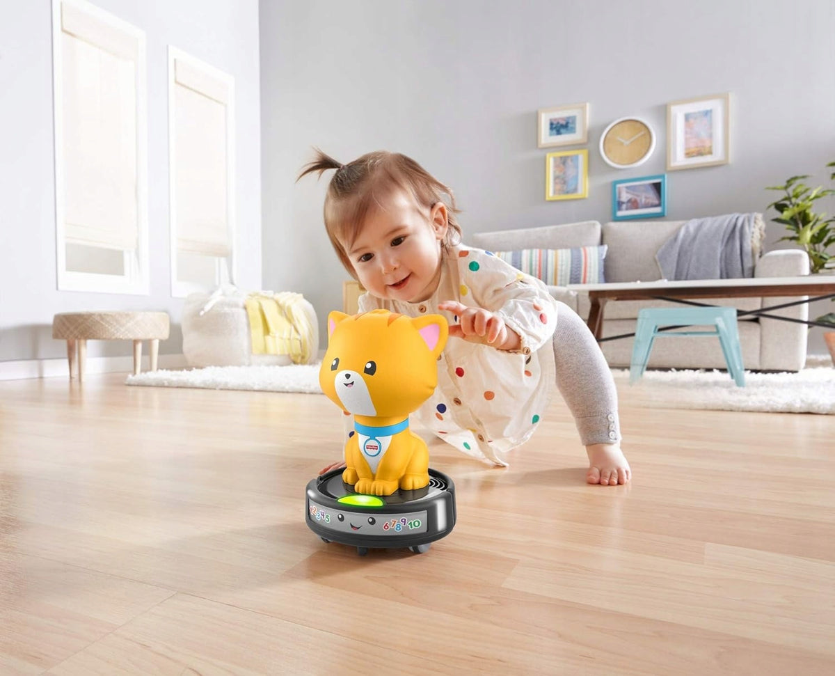 FISHER-PRICE GMX70 cat on a self-propelled vacuum cleaner