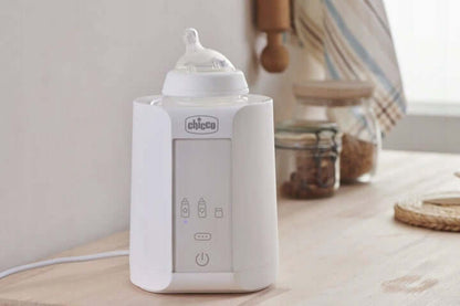 CHICCO Home Travel PODGRZEWACZ DO BUTELEK auto dom. Biały cyfrowy podgrzewacz butelek Chicco do domu i samochodu.