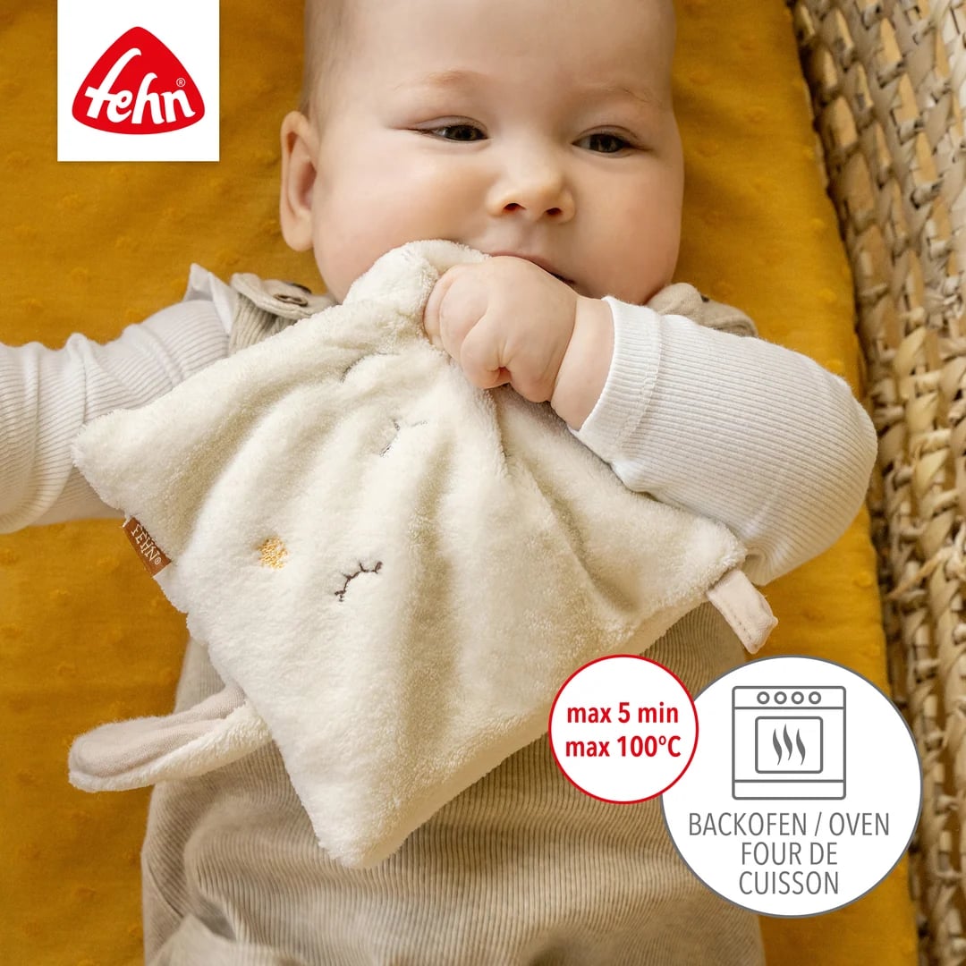 Poglądowa grafika dziecka trzymającego jasną poduszkę owieczkę, obok piktogramu piekarnika.