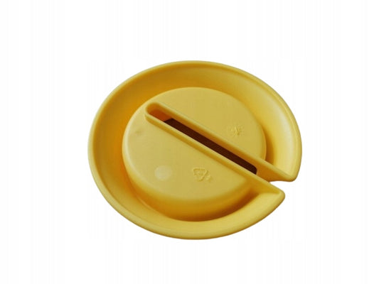 MEDELA okrągła podstawka pod butelkę laktatora, żółta, plastikowa, wolna od BPA, kompatybilna z butelkami Medela