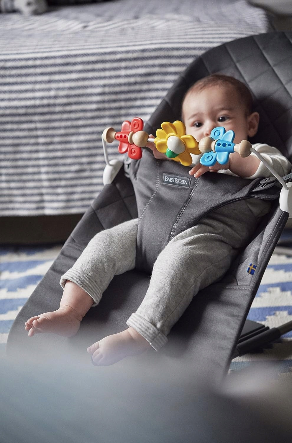BabyBjorn Flying Friends colors: red, yellow, blue